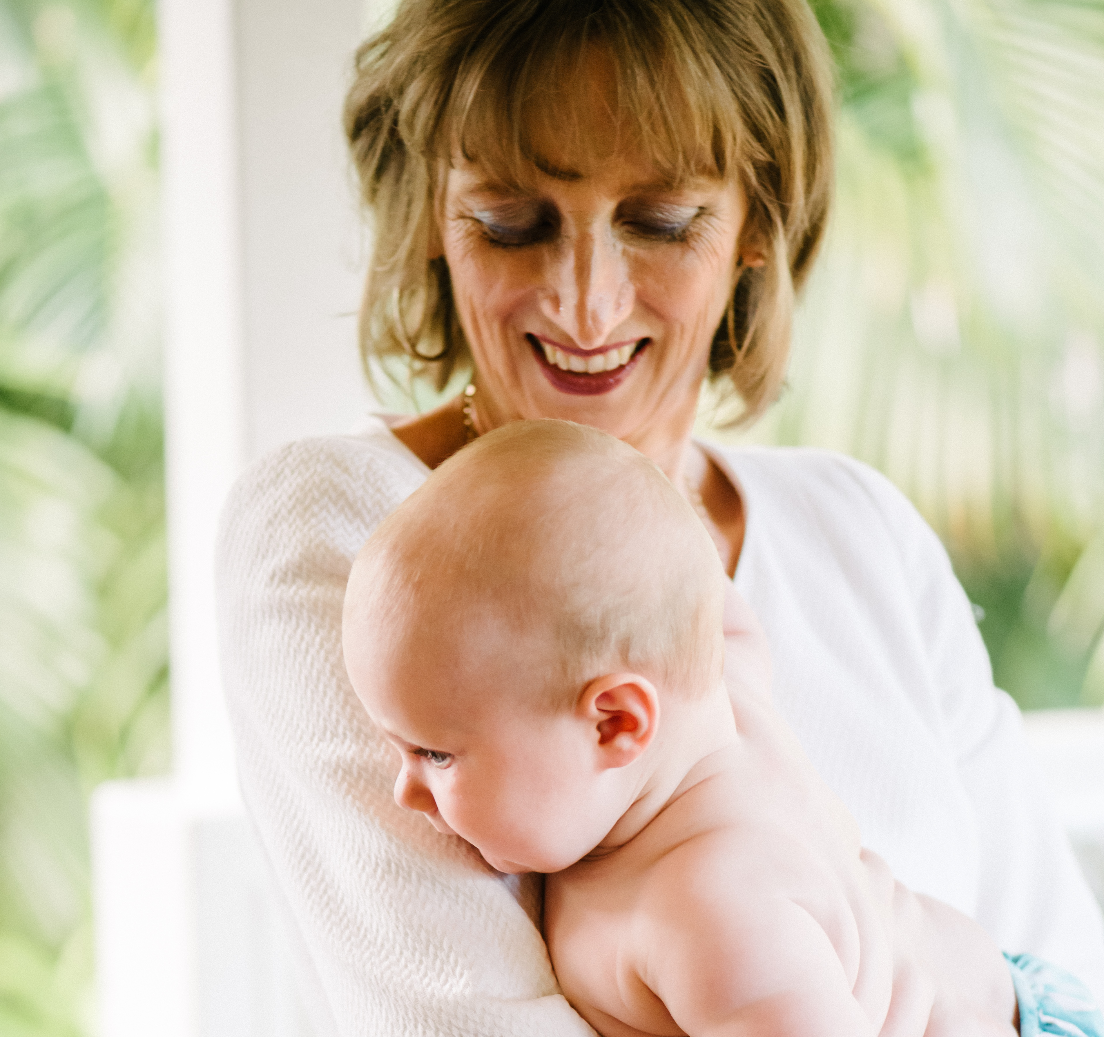 Image of Dr Pam holding a baby