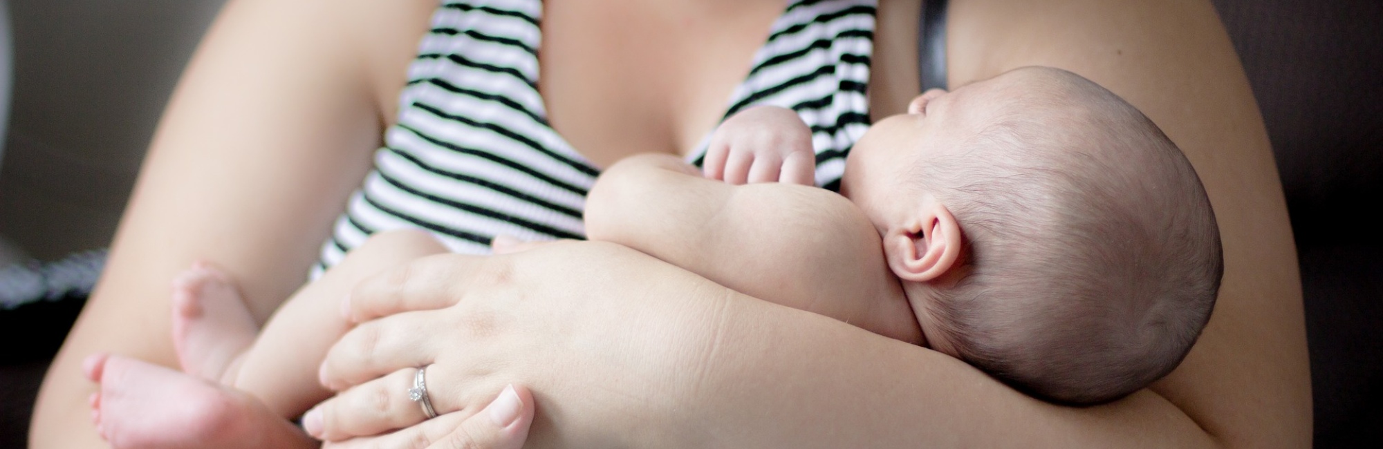caucasian mother holding baby in her arms