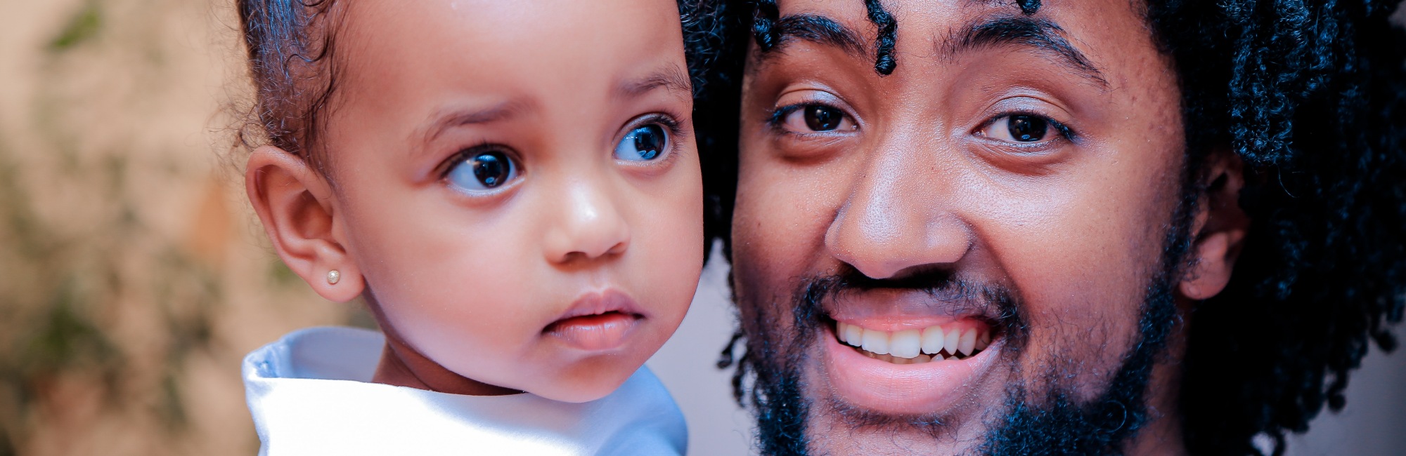 happy father and curious baby daughter
