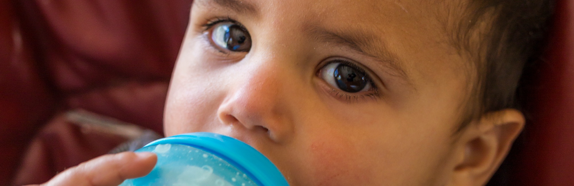 toddler bottle feeds themselves