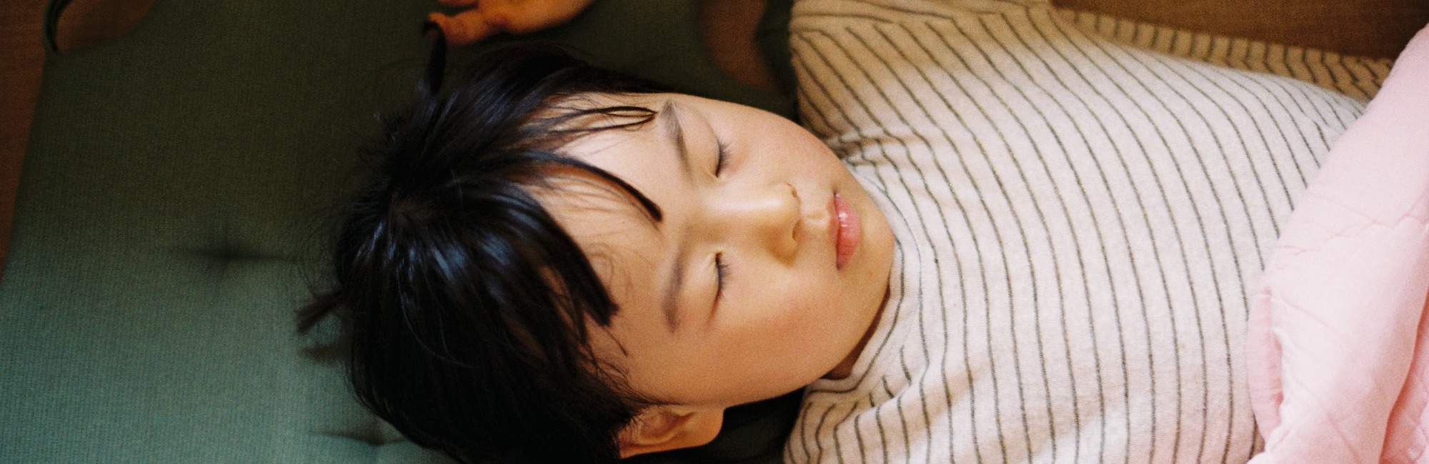 asian baby sleeping in the daylight