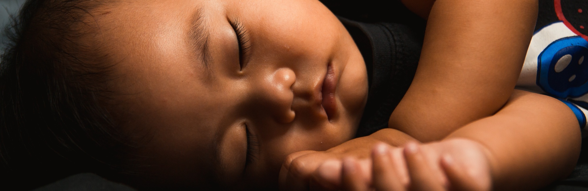 toddler sleeping on their side