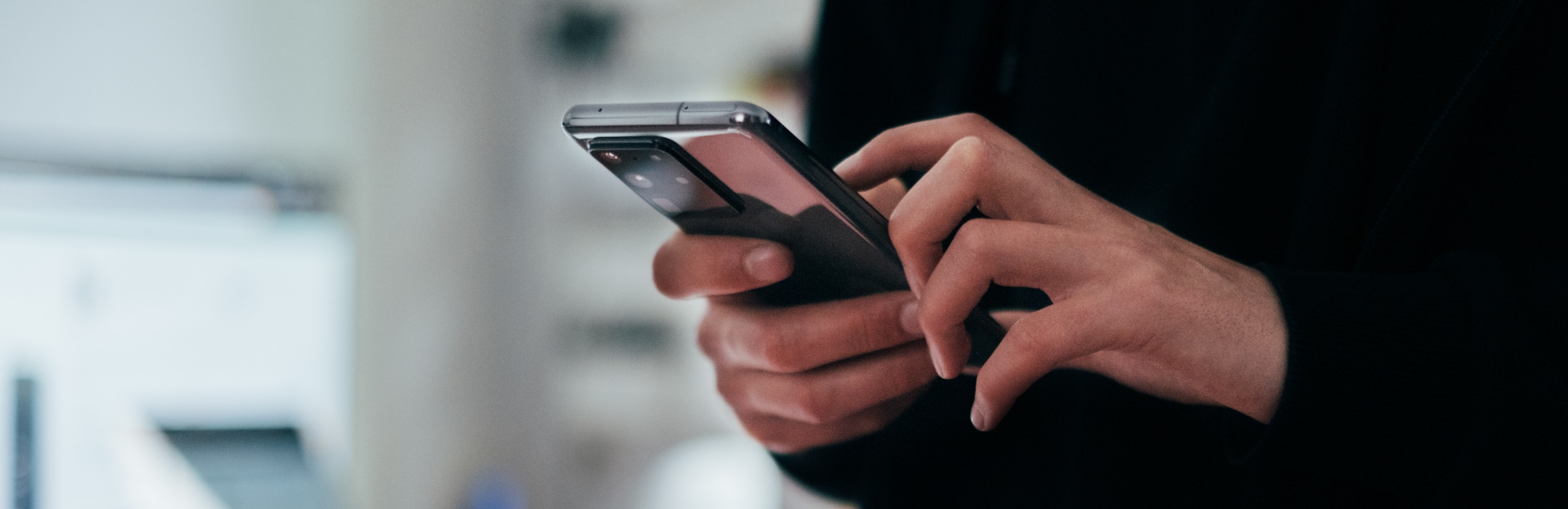 adult uses an app on their phone
